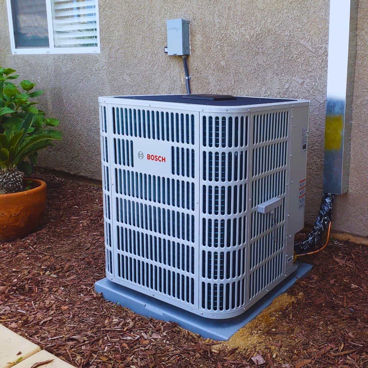 AC unit outside the house for energy efficiency assessment.