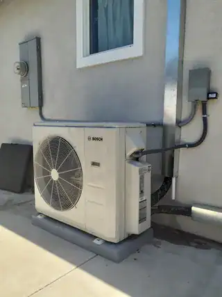 Bosch ductless mini-split multi-zone system with outdoor unit and indoor wall-mounted heads