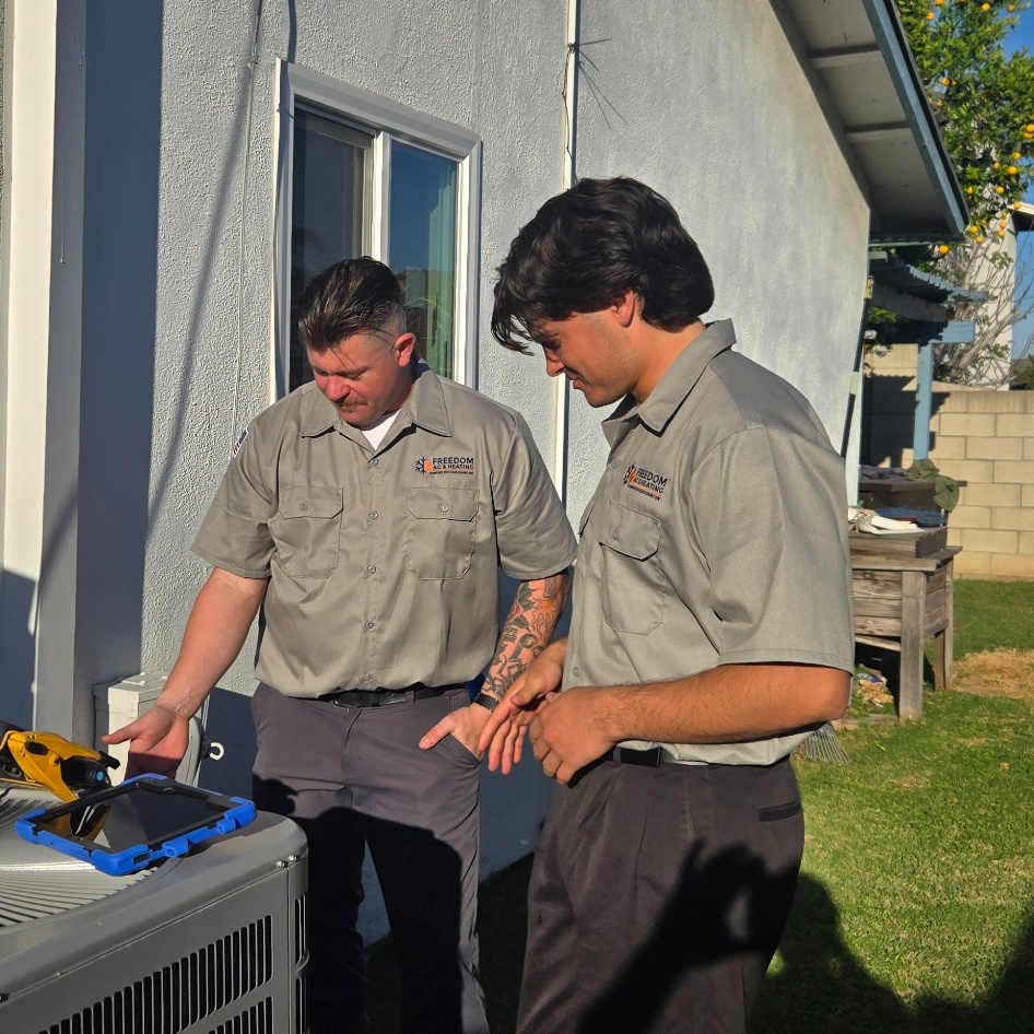 Freedom AC and Heating technicians performing AC repair in Brea, CA