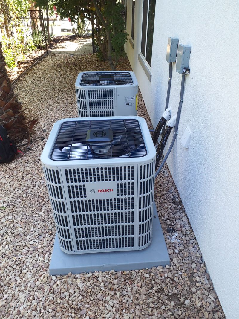 Professional Bosch heat pump condenser installation at a residential property